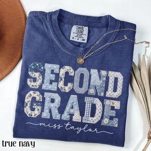True navy Comfort Colors graphic t-shirt with blue patchwork “SECOND GRADE Miss Taylor” lettering, cute teacher shirt, elementary teacher tee, back to school outfit, classroom apparel, personalized teacher gift, women’s casual graphic t-shirt