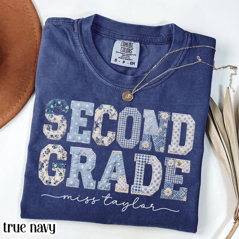 True navy Comfort Colors graphic t-shirt with blue patchwork “SECOND GRADE Miss Taylor” lettering, cute teacher shirt, elementary teacher tee, back to school outfit, classroom apparel, personalized teacher gift, women’s casual graphic t-shirt