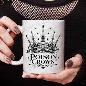 May include: White ceramic mug featuring a black and gray Poison Crown design. The design includes a crown with a skull, thorns, and the words "Poison Crown" in a gothic font. The mug is held by a person.