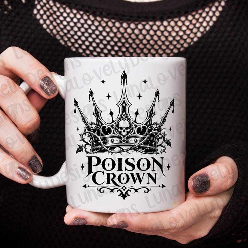 May include: White ceramic mug featuring a black and gray Poison Crown design. The design includes a crown with a skull, thorns, and the words "Poison Crown" in a gothic font. The mug is held by a person.