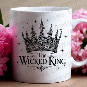 May include: White ceramic mug featuring a detailed black crown design with the text "The Wicked King". The design includes ornate details and star accents, perfect for a regal theme.