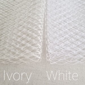 Birdcage veil with scattered pearl edge. Available in ivory or white