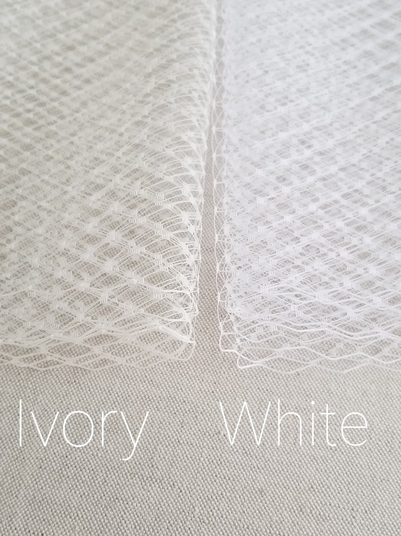 Birdcage veil with scattered pearl edge. Available in ivory or white