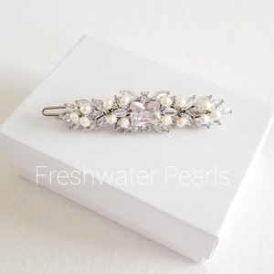 Cubic zirconia hair clip for bride. Available with shell pearls, freshwater pearls or crystal pearls. Silver or gold color options.