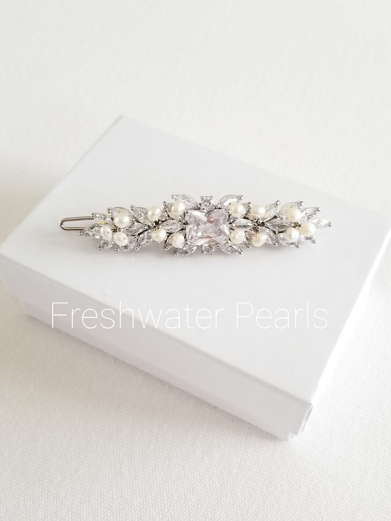 Cubic zirconia hair clip for bride. Available with shell pearls, freshwater pearls or crystal pearls. Silver or gold color options.