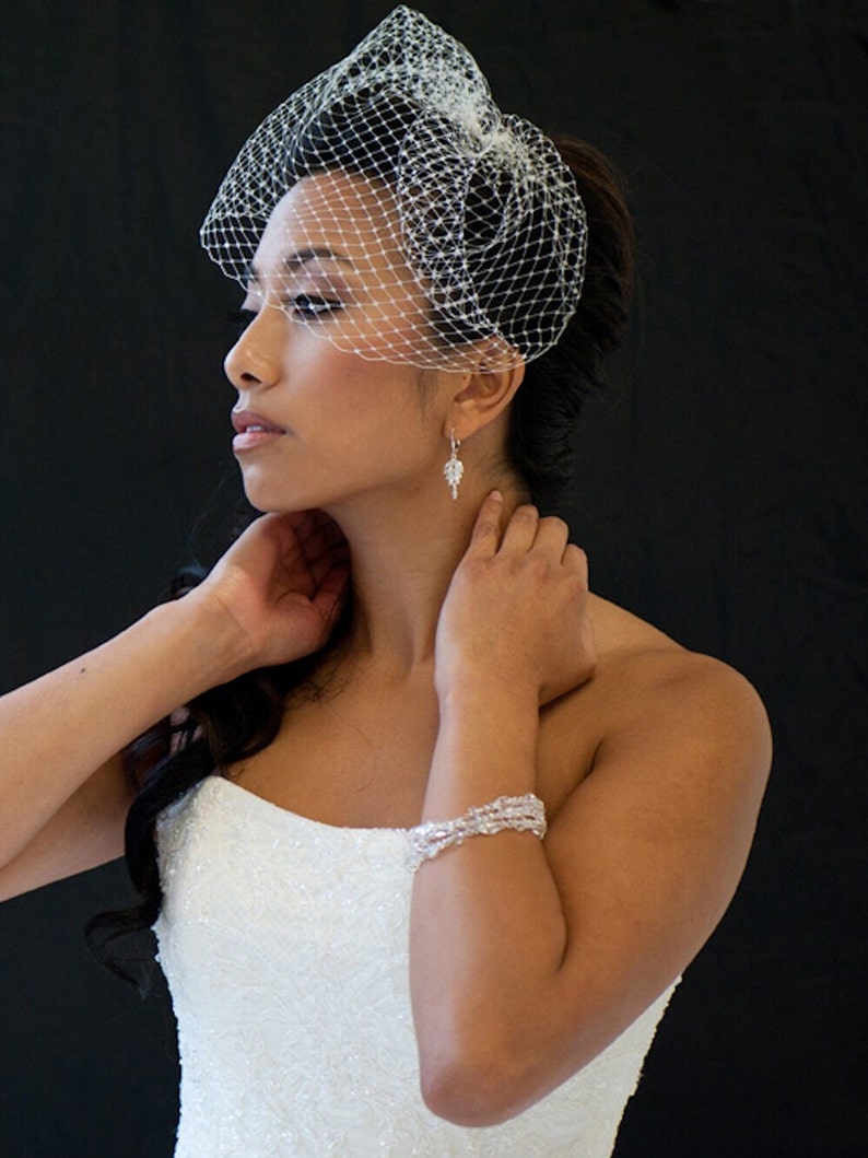 Short 9 inch birdcage veil made with Russian netting for weddings. Available in White or Ivory.