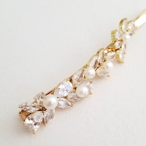 Hair clip shown in gold color.