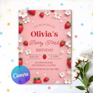 Puede incluir: Una invitación rosa de cumpleaños con el texto "Olivia's Berry First Birthday", fresas y flores blancas. El logotipo de Canva es visible. También incluye la fecha y hora de la fiesta.