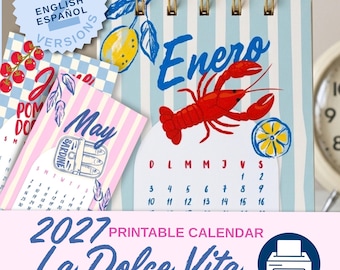 May include: A 2027 printable calendar titled La Dolce Vita featuring spiral-bound pages with illustrations of a red lobster, lemons, and sardines. The pages display months like Enero and May with striped backgrounds in blue, white, and pink.