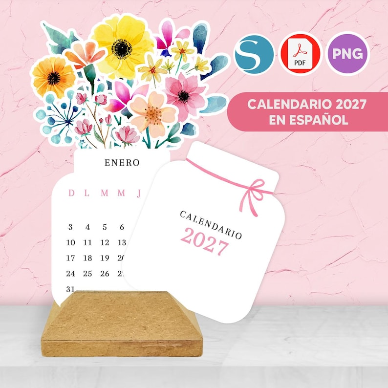 May include: A 2027 calendar in Spanish featuring a watercolor floral arrangement of yellow, pink, and blue flowers. The calendar pages are shaped like jars, with one page showing the month of Enero and the other labeled Calendario 2027.