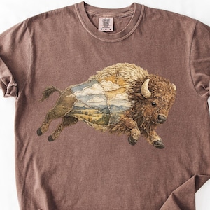 May include: A set of three ceramic mugs with a speckled, matte finish. The mugs are in shades of cream, light gray, and dark gray. Each mug has a simple, minimalist design, perfect for coffee or tea.