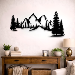 May include: Black metal wall art depicting a mountain range with pine trees. The silhouette design features peaks and evergreen trees, creating a nature-inspired scene. This decorative piece is suitable for indoor spaces.