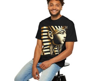 May include: A black t-shirt with a gold and black graphic of an Egyptian pharaoh's head.