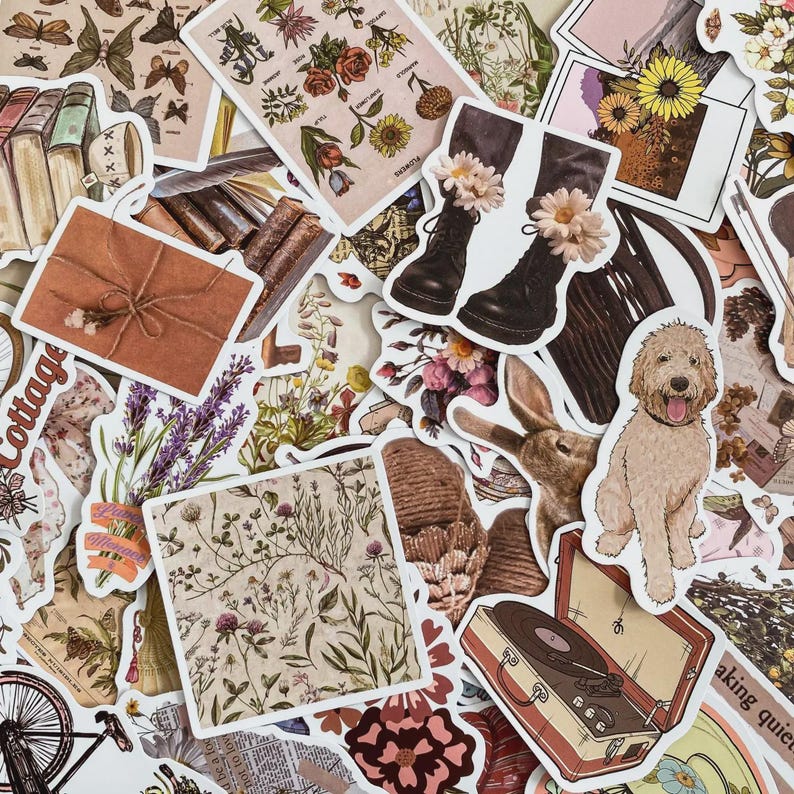 May include: A selection of vintage-style stickers. The stickers depict various images, including flowers, books, boots adorned with flowers, a dog, a rabbit, and a record player. The color scheme incorporates beige, brown, and floral designs.