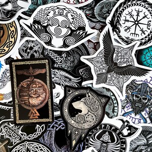 May include: A collection of black and white stickers featuring various Norse and Celtic designs. The stickers include images of wolves, ravens, runes, and other symbols.