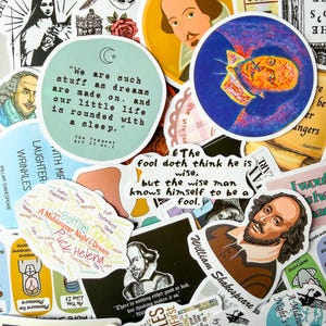 May include: A selection of Shakespeare-themed stickers, featuring quotes and illustrations. The stickers include quotes such as "We are such stuff as dreams are made on" and portraits of Shakespeare. Various colors and shapes.
