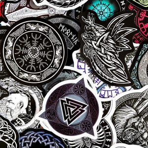 May include: A collection of black and white stickers with various Norse and Viking symbols, including runes, knotwork, and animal imagery. The stickers feature a variety of designs, including a wolf, a raven, and a shield.