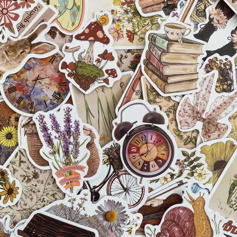 May include: A selection of vintage-style stickers with diverse designs. The stickers depict a rabbit, a clock, mushrooms, books, flowers, a bicycle, and a snail. The color scheme is mainly warm, earthy tones with splashes of colour.
