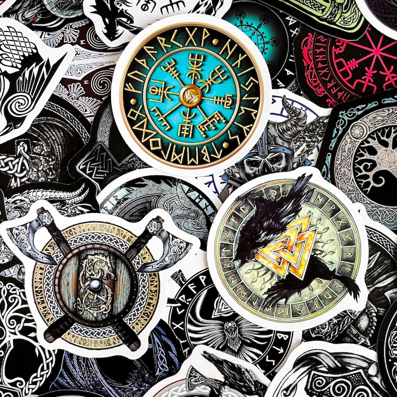 May include: A collection of colorful stickers featuring Viking symbols, runes, and imagery. The stickers are circular and feature a variety of designs, including a compass, a raven, and a shield with axes.