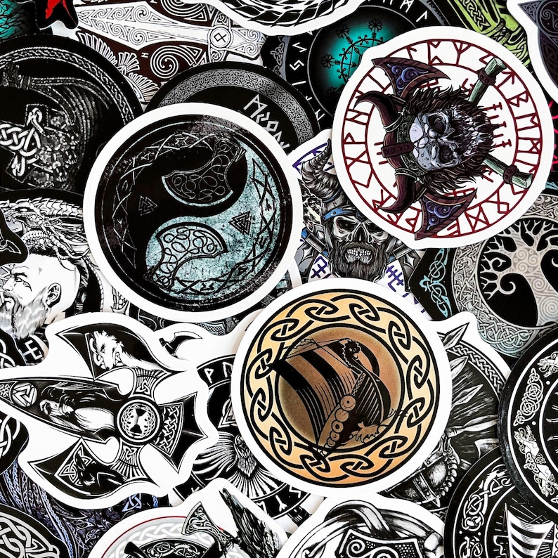 May include: A collection of round stickers with various black and white designs, including a yin yang symbol, a viking ship, and a tree of life. The stickers are on a white background.