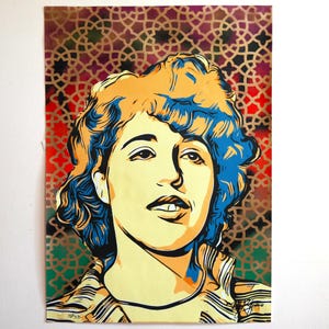 May include: A pop art style portrait of a woman with yellow skin, blue and yellow hair, and a striped shirt. The background features a gold geometric pattern over red and green. The artwork is signed in the bottom right corner.