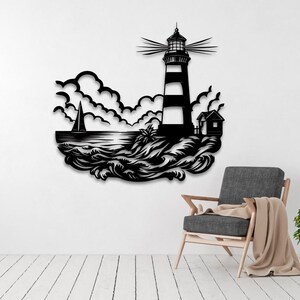 May include: Black and white silhouette wall art depicting a lighthouse with a sailboat in the foreground and waves crashing against the shore. The lighthouse has a striped design and a light on top. The art is ideal for a nautical themed home decor.