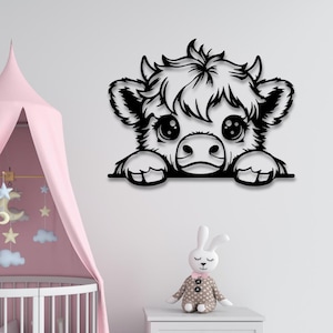 May include: Black and white silhouette of a cow's face peeking over a surface. The cow has large eyes and a fluffy head.