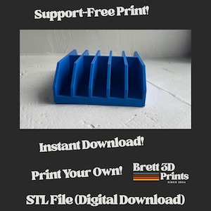 May include: A blue 3D printed organizer with five vertical slots. The image includes the text: Support-Free Print!, Instant Download!, Print Your Own!, Brett 3D Prints SINCE 2024, and STL File (Digital Download). The object has a rectangular base.