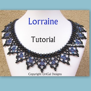 May include: A black and blue beaded necklace with a geometric design. The necklace is on a white mannequin bust. The text "Lorraine Tutorial" is written in blue letters above the necklace. The text "Copyright LiriGal Designs" is written below the necklace.