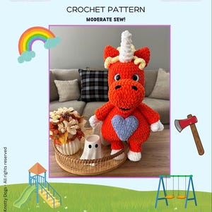 May include: A bright orange crocheted unicorn plush toy with a white horn, yellow mane, and a light blue heart on its chest. The toy features black safety eyes and white accents on its hands and feet, presented as a Buddy crochet pattern.