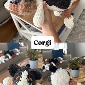 May include: Crocheted Corgi dog plush toy in black, white, and brown. The plush has a fluffy texture and is held up by a person. The word "Corgi" is displayed in a white box. Other similar plush toys are visible in the background.
