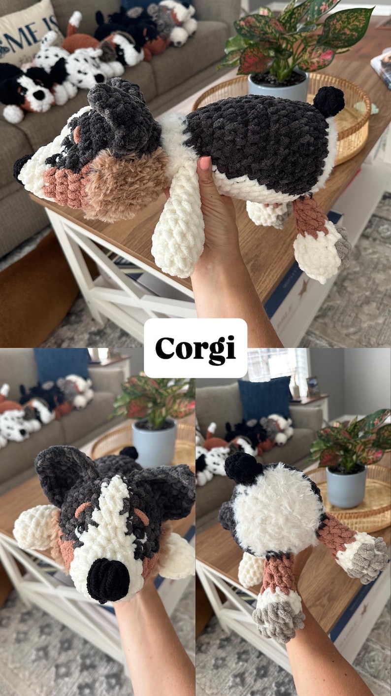 May include: Crocheted Corgi dog plush toy in black, white, and brown. The plush has a fluffy texture and is held up by a person. The word "Corgi" is displayed in a white box. Other similar plush toys are visible in the background.