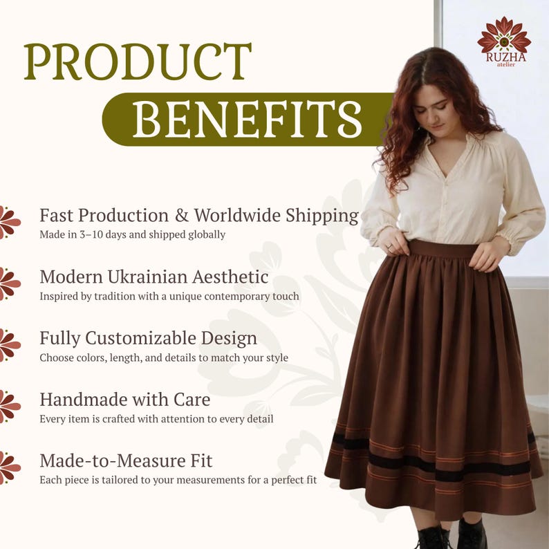 May include: A long brown skirt featuring a wide black horizontal band near the hem, accented by thin orange stripes. The skirt is paired with a cream-colored long-sleeved blouse with a button-down front and gathered cuffs, creating a two-piece outfit.
