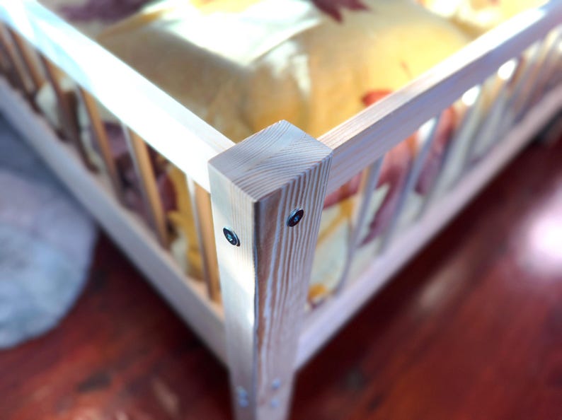 Toddler bed frame close up pine wood texture