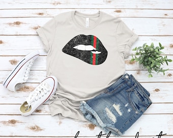 Black Biting Lips with Red and Green Ribbon T-shirt | Designer T-shirt