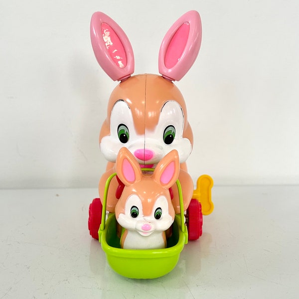 Vintage hard plastic wind-up non-working bunny pushing cart with little bunny made in Japan