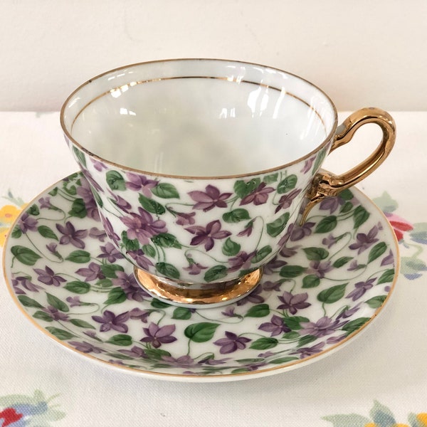 Vintage chintz teacup tea cup and saucer with violets purple white green Sterling China Japan