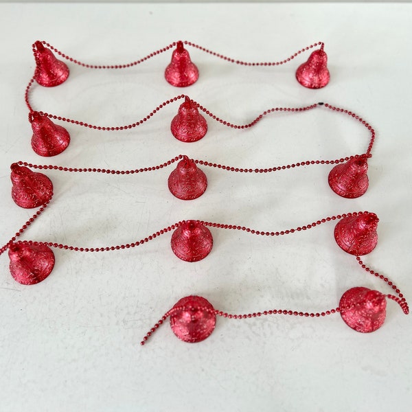 Vintage Christmas garland of red plastic textured bells on red beads 13 bells and almost 3 yards long