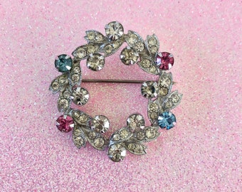 Vintage pin brooch wreath of clear blue pink rhinestones by Eisenberg midcentury