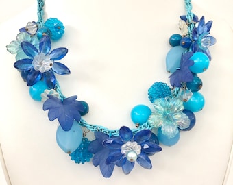 Necklace of vintage lucite plastic flower beads blue and turquoise on vintage blue chain