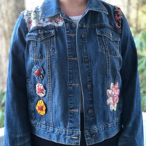 Vintage jean jacket custom with vintage hankies linens buttons quilt patches yo-yo’s embroidered trim pom poms
