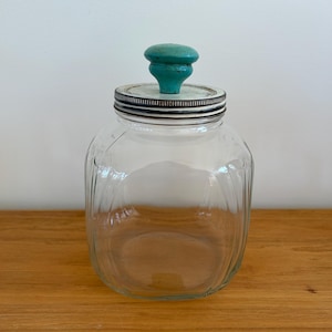 Large vintage Hoosier glass jar with white lid and blue-green wood knob Hazel Atlas