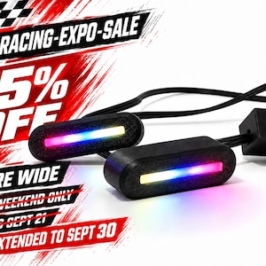 May include: Two black oval-shaped LED indicator lights with integrated rainbow-colored light strips, connected by black wiring. The image features promotional text: SIM-RACING-EXPO-SALE, 15% OFF, STORE WIDE, THIS WEEKEND ONLY, ENDS SEPT 21, EXTENDED TO SEPT 30.