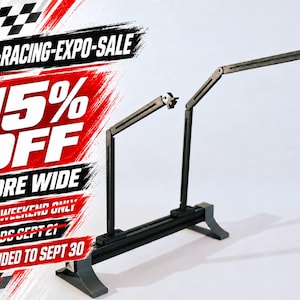 May include: A black metal sim-racing monitor stand with two adjustable arms and a base. The image features promotional text: SIM-RACING-EXPO-SALE, 15% OFF STORE WIDE, THIS WEEKEND ONLY, ENDS SEPT 21, EXTENDED TO SEPT 30, and a checkered flag graphic.