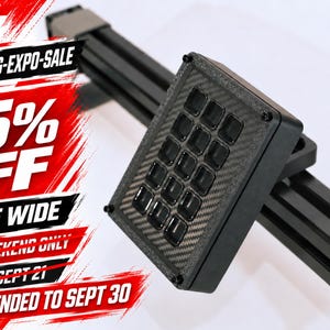 May include: A black button box with a carbon fibre texture and twelve square buttons, mounted on a black aluminium extrusion rail. The image includes red and white text stating SIM-RACING-EXPO-SALE, 15% OFF, STORE WIDE, THIS WEEKEND ONLY, ENDS SEPT 21, and EXTENDED TO SEPT 30.