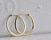classic fine oval hoops in hammered 14k gold,  solid 14k gold hoops endless style, eco friendly jewelry