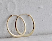 classic fine oval hoops in hammered 14k gold,  solid 14k gold hoops endless style, eco friendly jewelry