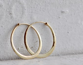 classic fine oval hoops in hammered 14k gold,  solid 14k gold hoops endless style, eco friendly jewelry