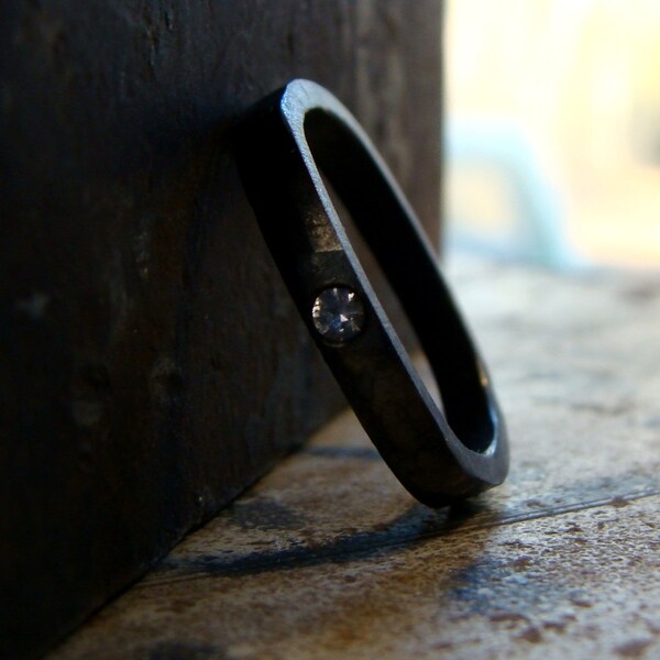 Darkened sterling silver ring  with gypsy set white sapphire square ring band