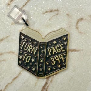 Turn to page 394 |  dust plug | phone charm | ereader charm | usb-c | lightning | kindle dust plug | iphone dust plug | potter | snape